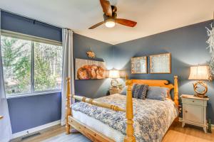 a bedroom with a bed and a ceiling fan at Classy Clayton Home with Views Less Than 1 Mi to Downtown! in Clayton