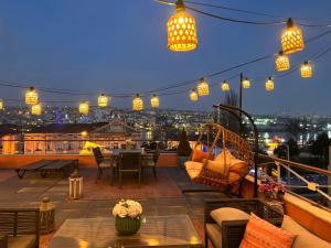 a balcony with a view of a city at night at Waterfront Terrace House Bosphorus Istanbul in Istanbul