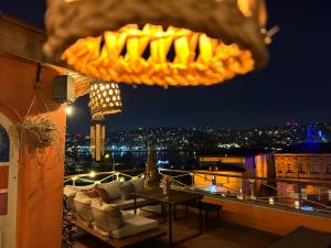 a view of a balcony at night with a table at Waterfront Terrace House Golden Horn Istanbul in Istanbul
