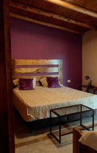 Una cama o camas en una habitación de Posada Bonarda San Rafael