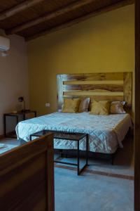 Una cama o camas en una habitación de Posada Bonarda San Rafael