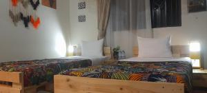 Katil atau katil-katil dalam bilik di Aivilo Home