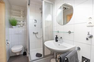 a bathroom with a shower and a sink and a toilet at Neue Ferienwohnung in Marl in Marl