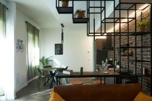 a living room with a table and chairs at Plebiscito Old Fashion in Castel di Sangro