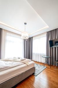 Posteľ alebo postele v izbe v ubytovaní Apartament Szymanowskiego
