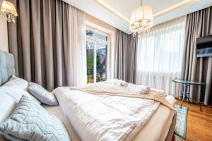 Posteľ alebo postele v izbe v ubytovaní Apartament Szymanowskiego