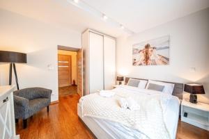 Posteľ alebo postele v izbe v ubytovaní Apartament Szymanowskiego