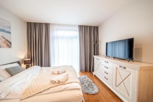 Posteľ alebo postele v izbe v ubytovaní Apartament Szymanowskiego