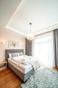 Posteľ alebo postele v izbe v ubytovaní Apartament Szymanowskiego