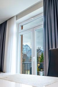 Posteľ alebo postele v izbe v ubytovaní Apartament Szymanowskiego