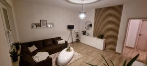 a living room with a couch and a table at Ferienwohnung Maasch in Vierraden