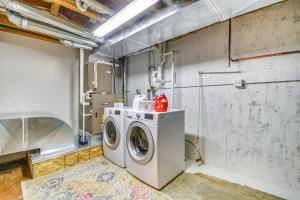 a laundry room with a washing machine in it at Rural Cody Vacation Rental about 10 Mi to Downtown! in Cody