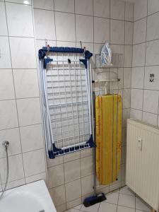 a bathroom with a toilet and a radiator at Ferienwohnung Latscha - 2 Zimmer Wohnung mit Klimaanlage,Balkon, Kinderspielplatz in Ettenheim
