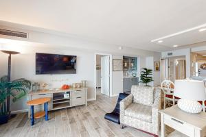 a living room with a couch and a table at Sea Colony - 1401S Edgewater House Rd. in Bethany Beach