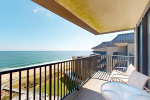 a balcony with chairs and a view of the ocean at Sea Colony - 1501N Edgewater House Rd. in Bethany Beach