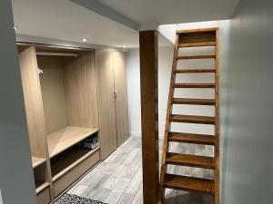 a room with a staircase leading to a closet at Souplex bordeaux gare saint jean in Bordeaux +1 photo