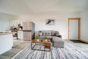 a living room with a couch and a table at 4 Mi to Lake Erie Access Condo on the Greens in Erie