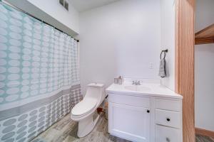 a bathroom with a toilet and a sink at 4 Mi to Lake Erie Condo with Golf Course Views! in Erie