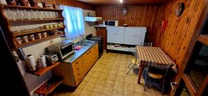 an overhead view of a kitchen with a table at Casa completa para 5 personas. in San Carlos de Bariloche