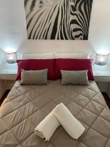 Letto o letti in una camera di Sweet Aura
