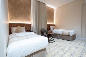 Кровать или кровати в номере فندق روحة المقام