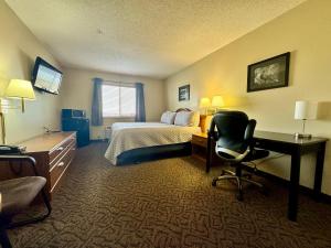 TV a/nebo společenská místnost v ubytování Quilt Inn