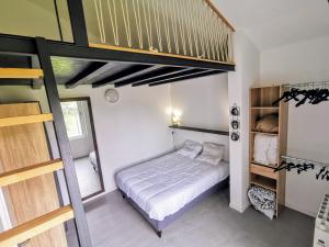 a bedroom with a bed and a loft bed at Sea Sun and Thau in Marseillan