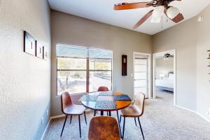 a dining room with a table and chairs at The Greens at Ventana Canyon #1205 in Tucson