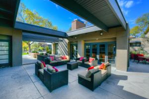 a patio with couches and tables on a building at The Greens at Ventana Canyon #1205 in Tucson