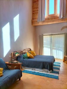 Postel nebo postele na pokoji v ubytování Mas la Llum, la casa de palla