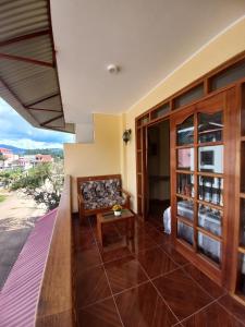 a living room with a couch and a table at Hospedaje "LOS QUETZALES DE OXAPAMPA" in Oxapampa