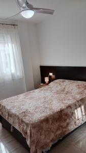 a bedroom with a large bed in a room at GETAWAYS in Valdés
