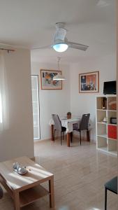 a living room with a table and a dining room at GETAWAYS in Valdés
