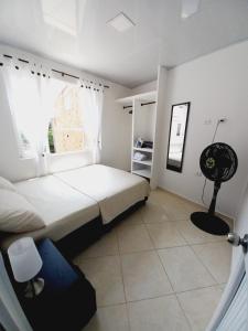 Katil atau katil-katil dalam bilik di Apartamento en real de minas