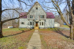 a large white house with a red roof at Altmar Home with Fire Pit Less Than 1 Mi to Salmon River! in Pulaski