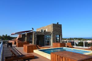 a swimming pool on the roof of a house at Hotel Bahamas in Montevideo
