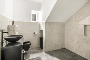 a bathroom with a sink and a toilet at Modern 3-Bed Apartment in Papaya Resort in Grote Berg