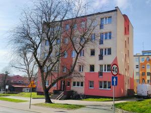 a large building on the side of a street at Apartament Inka in Goleniów
