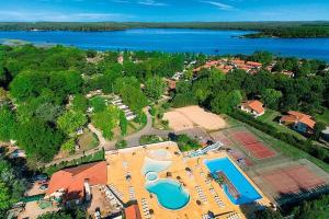 an aerial view of a resort with a swimming pool at La cabane du lac in Aureilhan