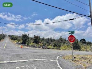 a stop sign on the side of an empty road at Bring Your Camp in Hawaiian Ocean View