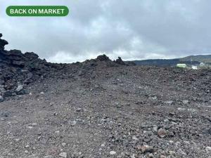 a large pile of dirt and rocks on a mountain at Bring Your Camp in Hawaiian Ocean View