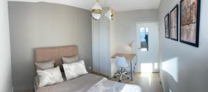 Postel nebo postele na pokoji v ubytování Winnie- Chambre dans un appartement spacieux et charmant
