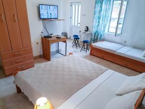 Llit o llits en una habitació de Amisos Apartmani