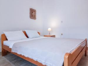 Llit o llits en una habitació de Amisos Apartmani