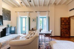 a bedroom with a bed and a table at Casa Guadalupe in Seville