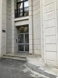 a entrance to a building with a large door at Designer Flat for 4, Heart of Bucharest, Kitchen in Bucharest