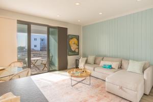 a living room with a couch and a table at The Hermitage at Napeague in Amagansett