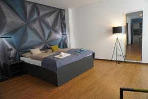 Ένα ή περισσότερα κρεβάτια σε δωμάτιο στο Fair n Square Hotel 24 Stunden Self-Check In +136 φωτογραφίες