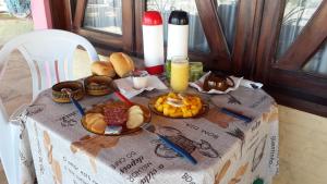 a table with food and a plate of food on it at OCEANO in Pecém
