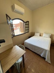 Ένα ή περισσότερα κρεβάτια σε δωμάτιο στο Hotel Casarão
